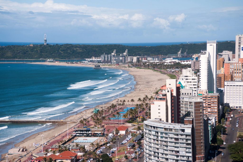 Seashore and landscape with buildings and beach in Durban, South Africa. Photo by Oldeani0.